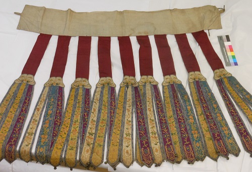 Dancer’s skirt, magenta was identified with other dyes in a sample from the brown stripes ©Jing Han. By kind permission of National Museums Scotland. 
