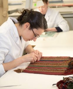 Keira Miller undertaking the stitched support of a chuspa