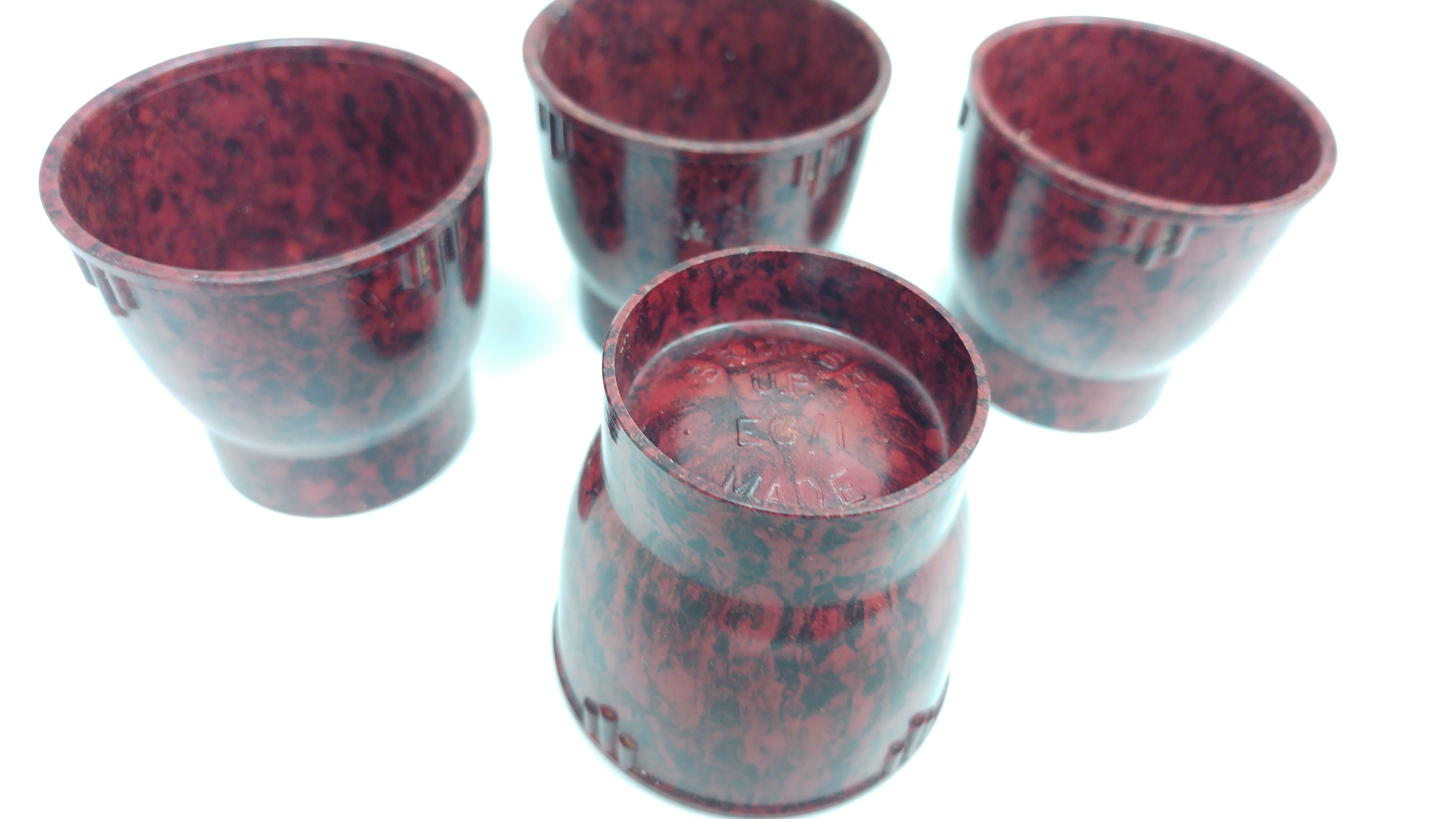 Phenol formaldehdye plastic egg cups with design information moulded into the base (c) Anita Quye (1)